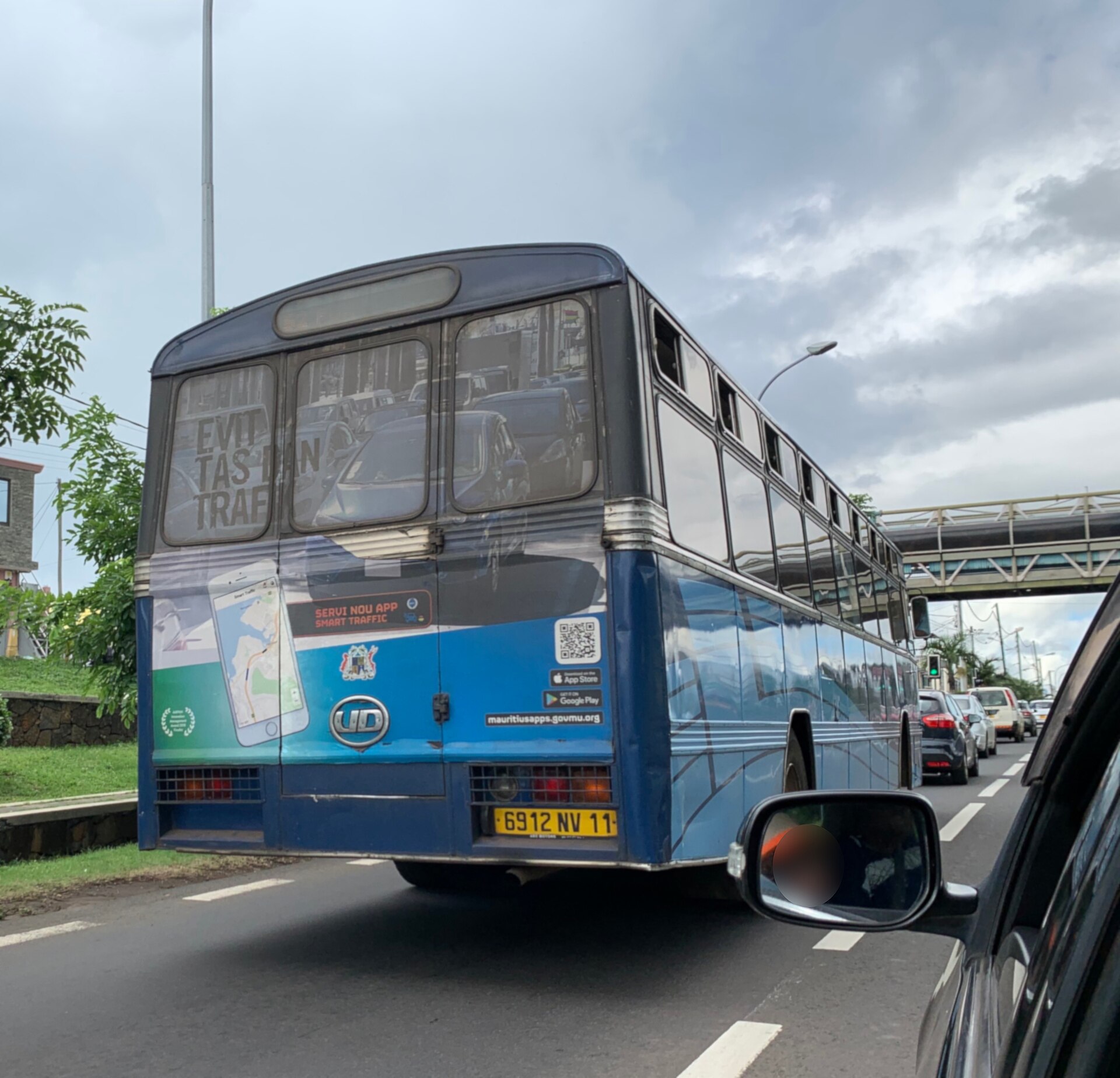 The back of a bus on a fast road towards Port Louis in Mauritius