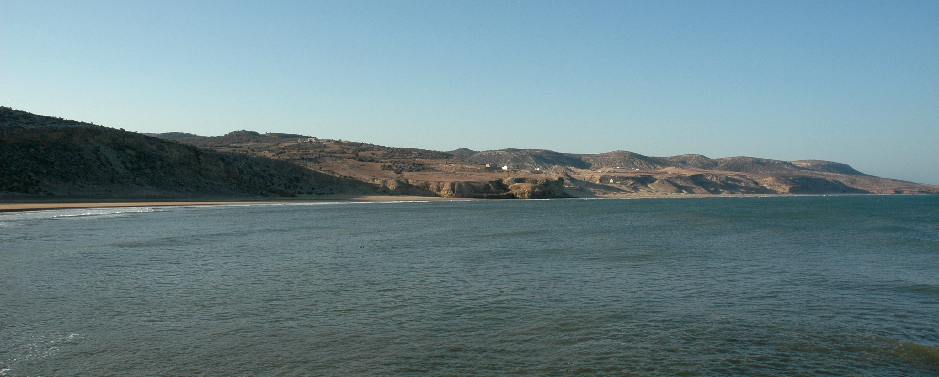 Low cliffs and a sandy shoreline near Iftane beach at Sidi Ahmed Essayeh